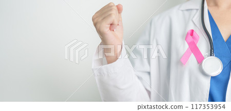 Pink October Breast Cancer Awareness month, woman doctor with pink Ribbon in hospital for support people life and illness. National cancer survivors month, Mother and World cancer day concept 117353954