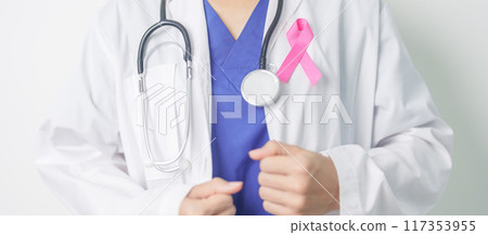 Pink October Breast Cancer Awareness month, woman doctor with pink Ribbon in hospital for support people life and illness. National cancer survivors month, Mother and World cancer day concept 117353955
