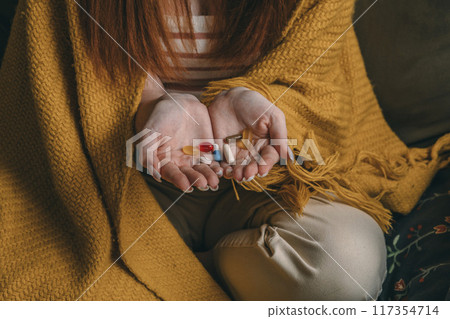 woman arranging her daily supplements, Managing Medication, A Step Towards Better Health 117354714