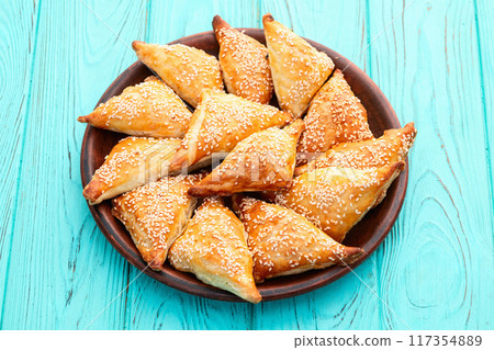 Homemade triangle puff pastry with meat on rustic background . Samosa 117354889
