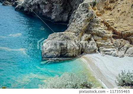 Coastal cliffs of limestone. The coast of Mediterranean Sea in Turkey. 117355465