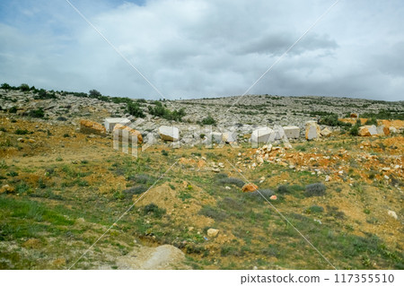 Marble quarry quarrying white marble in open pit 117355510