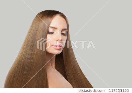 Portrait of female model. Woman with long brown hair, natural makeup and healthy clean skin 117355593