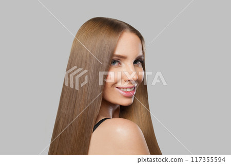 Elegant female model brunette with long hair and natural make-up posing isolated on white background 117355594