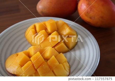 Taiwanese mangoes served on a Koishiwara ware plate Taiwanese mangoes served on a Koishiwara ware plate 117357875