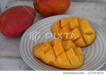 Taiwanese mangoes served on a Koishiwara ware plate 117357879
