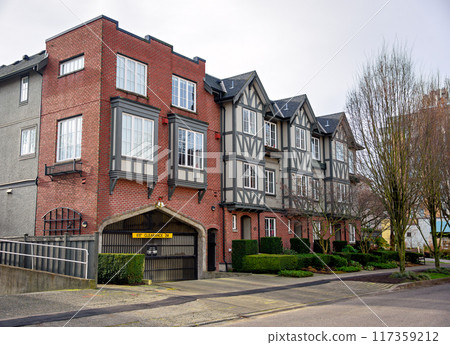 A perfect neighbourhood. Low rise residential building on winter season 117359212