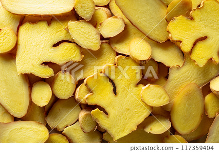 Close-up of fresh ginger slices. Close-up of fresh ginger slices. 117359404