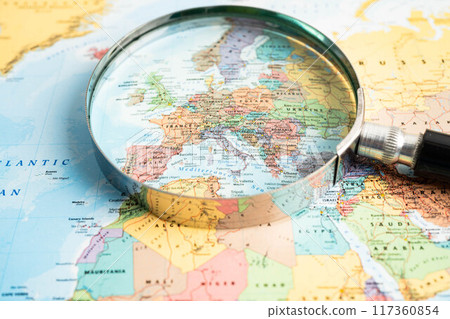 Bangkok, Thailand - June 15, 2024 Europe, Magnifying glass close up with colorful world map, travel, geography, tourism and exploration concept. Bangkok, Thailand - June 15, 2024 Europe, Magnifying glass close up with colorful world map, travel, geography, tourism and exploration concept. 117360854