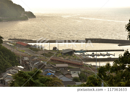 Echigo Tokimeki Railway 413 Series Express No. 4 running with the Sea of Japan in the background Echigo Tokimeki Railway 413 Series Express No. 4 running with the Sea of Japan in the background 117361633