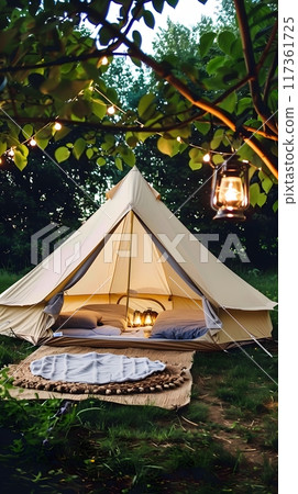 Spacious Tent Amidst Lush Greenery with Cozy Sleeping Bags and Illuminated Lanterns 117361725
