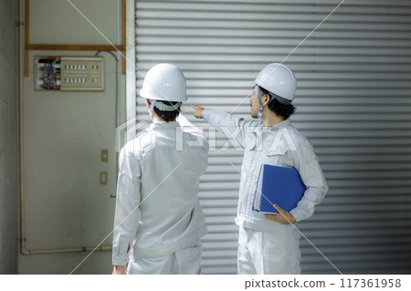 A man in work clothes checking the site 117361958