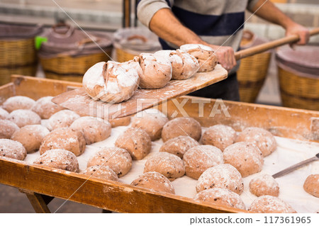 Bread preparation. loaves of dough before baking 117361965