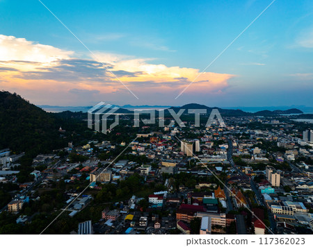 Aerial view of residential houses and driveways neighborhood during a fall sunset or sunrise time.Tightly packed homes.Top view over building houses in phuket thailand 117362023