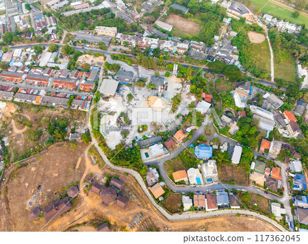 Aerial view of residential houses and driveways neighborhood during a fall sunset or sunrise time.Tightly packed homes.Top view over building houses in phuket thailand 117362045