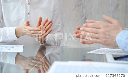 Unrecognizable business people clapping over glass table after c 117362270