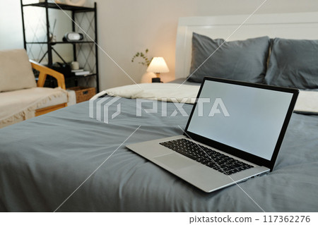 Laptop On Bed In The Bedroom Laptop On Bed In The Bedroom 117362276