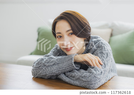 A knitted woman relaxing in her room A knitted woman relaxing in her room 117362618