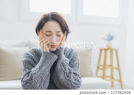 A knitted woman relaxing in her room A knitted woman relaxing in her room 117362626