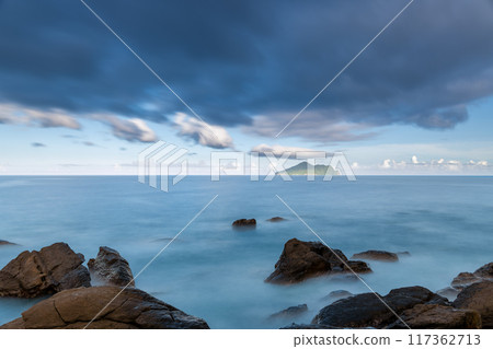 Turtle Island across the ocean on the horizon. Turtle Island across the ocean on the horizon. 117362713