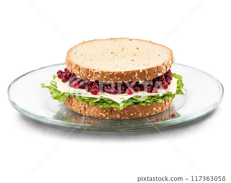 Sandwich turkey and Swiss cheese with cranberry sauce on whole wheat served on a transparent Sandwich turkey and Swiss cheese with cranberry sauce on whole wheat served on a transparent 117363058