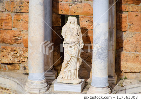 Marble statues at the columns of the amphitheater in Hierapolis, Turkey. Marble statues at the columns of the amphitheater in Hierapolis, Turkey. 117363308