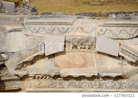 Bas-reliefs of antique scenes on the gables of the amphitheater in Hierapolis, Turkey. Bas-reliefs of antique scenes on the gables of the amphitheater in Hierapolis, Turkey. 117363321