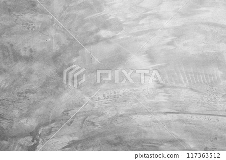 concrete wall with a raw, unfinished look showcases the rough texture of the material. The minimalist design highlights the industrial feel, with visible seams and natural imperfections adding concrete wall with a raw, unfinished look showcases the rough texture of the material. The minimalist design highlights the industrial feel, with visible seams and natural imperfections adding 117363512