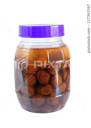 Fermented or pickled peach, plum cloves in a jar. Fermented or pickled peach, plum cloves in a jar. 117363567