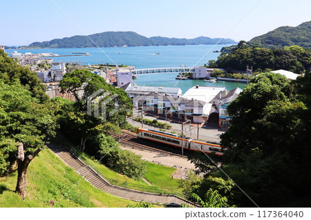 Toba Bay and the Kintetsu Shima Line train overlooking Shiroyama Park at Toba Castle Ruins Toba Bay and the Kintetsu Shima Line train overlooking Shiroyama Park at Toba Castle Ruins 117364040