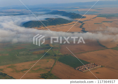 Aerial view of the mountains and fields in Bulgaria. View from a plane 117364917