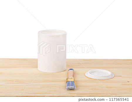 white paint with a brush on a wooden background with texture 117365541