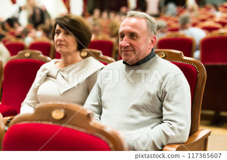 Elderly couple watching play in the theater Elderly couple watching play in the theater 117365607