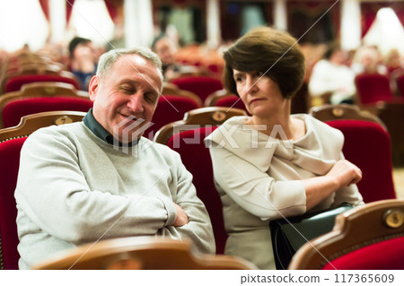 Mature man sleeping in theater during performance Mature man sleeping in theater during performance 117365609