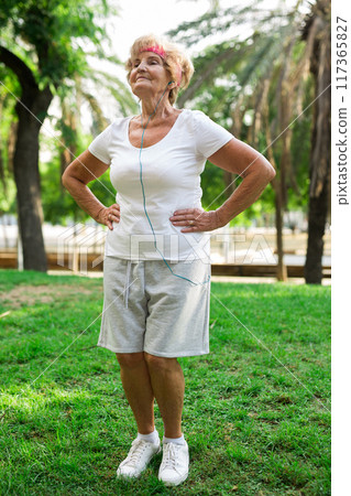 Mature woman training in park Mature woman training in park 117365827