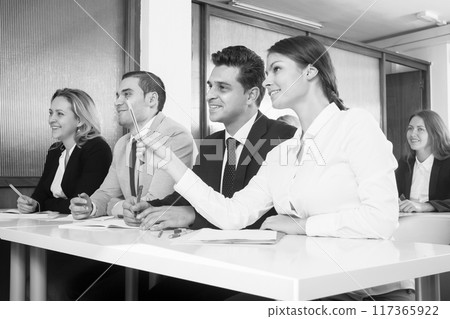 Students at a lecture at the university with their supervisor 117365922