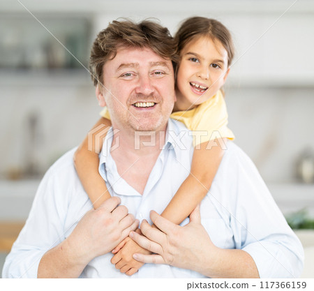 Father and daughter posing in kitchen at home 117366159