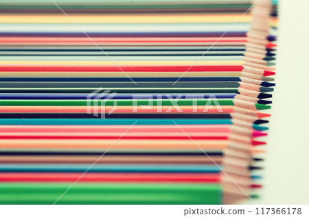 Colored pencils lying in row 117366178