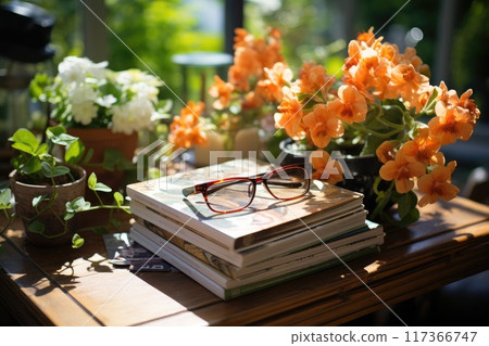 Magazines on table with eyeglasses. 117366747