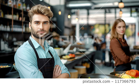 Confident Male Chef in Modern Restaurant Kitchen 117366793