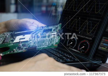 The concept of a technician using an electrical system analysis program and checking the motherboard. 117367373