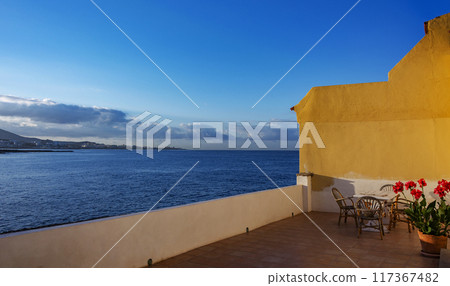 Verandah overlooking the ocean coast Verandah overlooking the ocean coast 117367482