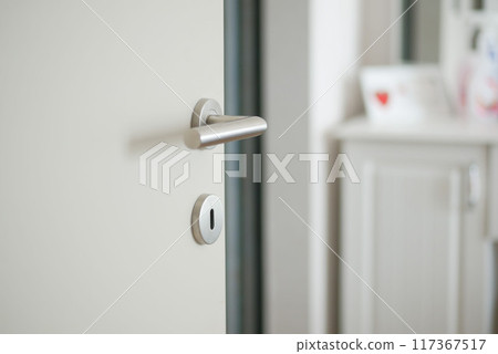 open door concept with Door handle and blur interior room background, 117367517