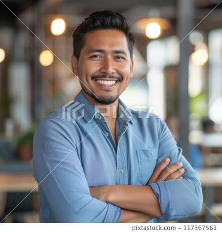 Portrait of a Hispanic male businessman 25-35 years in a suit against the background of an office 117367561
