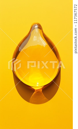 Macro photography close up of yellow liquid drops oil on a white background 117367572