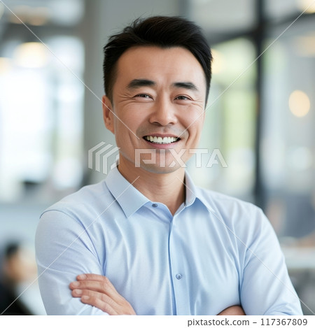 Portrait of a Chinese male businessman 35-50 years in a suit against the background of an office 117367809