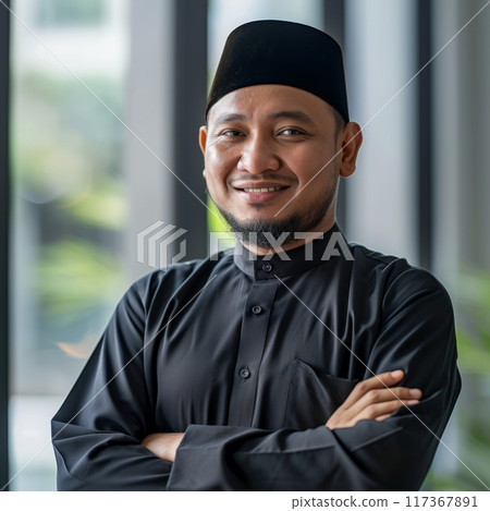 Portrait of an Islamic businessman 25-40 years against the background of the office 117367891
