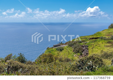 View of the ocean from a hill above the town of Calheta on the island of Madeira View of the ocean from a hill above the town of Calheta on the island of Madeira 117368739