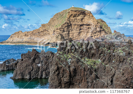 Rocky coast and cliffs of Porto Moniz on Madeira Island 117368767