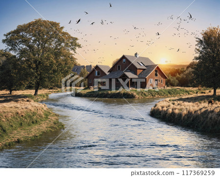 A house sits on a river bank with a view of the sun setting A house sits on a river bank with a view of the sun setting 117369259